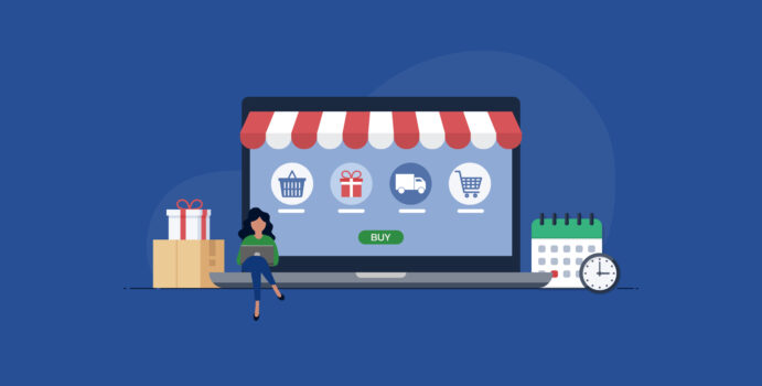 A woman sits in front of a large computer screen with an awning by a stack of boxes on one side of the screen while a calendar and clock sit on the other side.