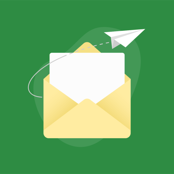 Envelope with paper and paper airplane next to it