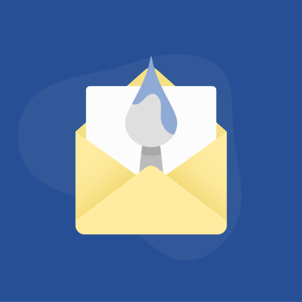 Paint brush and paper inside an envelope