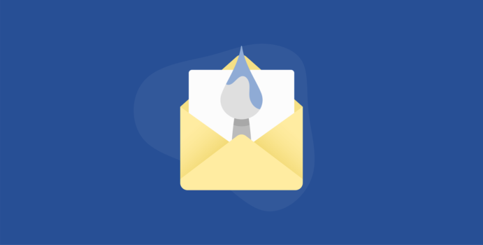 Paint brush and paper inside an envelope